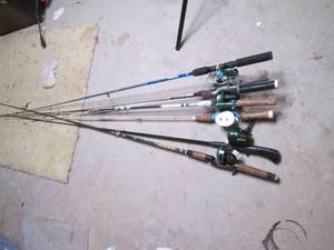 Lot of fishing rods and reels, some...