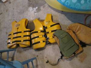 3 life preservers, 2 are heavy thic...