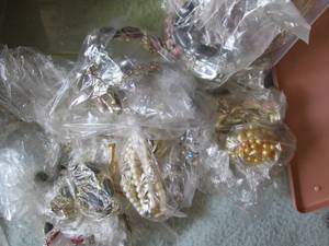 Plastic tub of costume jewlery...