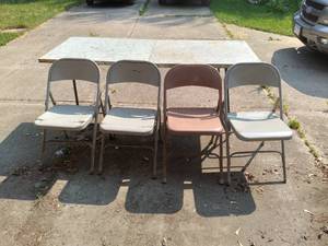 Set of 4 metal folding chairs and f...