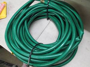 lot 25 image: green garden hose looks like 50 ft ...
