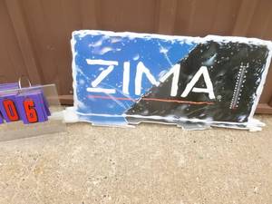 New Zima tin sign. 30 x 14. Missing thermometer. As shown.