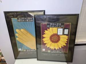 lot 205 image: Pair of Black Plastic Picture Frames