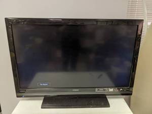 lot 28 image: Hitachi LCD 41 TV on a Stand