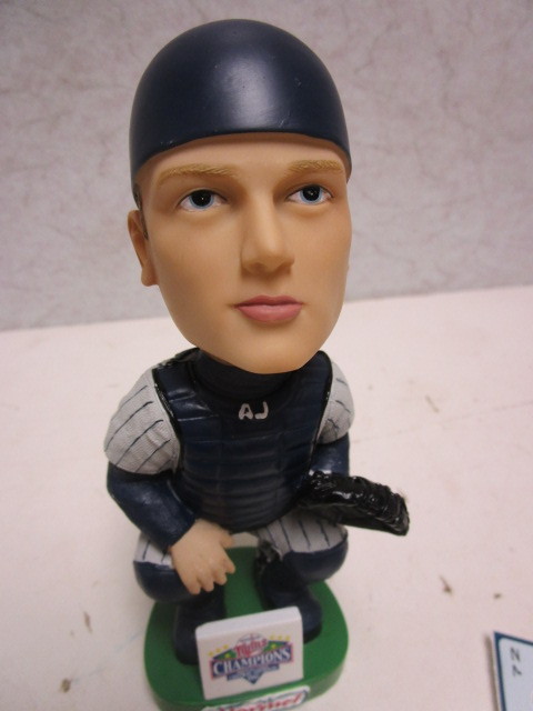lot 457 image: A.J. PIERZYNSKI MINNESOTA TWINS CENTRAL DIVISION CHAMPIONS BOBBLEHEAD DOLL, W CARD, TICKET STUB