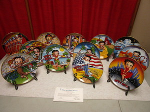 lot 447 image: TWELVE AUTHENTIC BETTY BOOP COLLECTOR PLATES TRIMMED IN 23K GOLD AND MADE BY THE DANBURY MINT