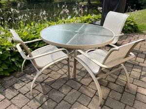 lot 75 image: Brown Jordan Glass Top Patio Table With Three Chairs