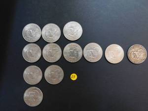 Twelve Clad Eisenhower Dollars 3 1971s and 8 1972s, 1 1976