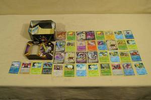 lot 94 image: Tin of Pokemon Cards - Full Art, Holos, Rares