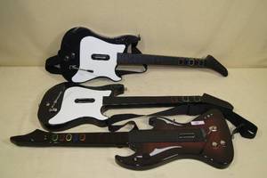lot 143 image: Playstation 2 Guitar Hero Guitars