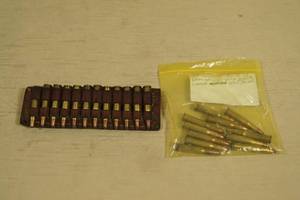 lot 21 image: 23 Rounds .30-30 Ammo with Hunter Leather Shell Holder