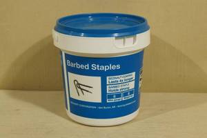 lot 124 image: 8 Lb Bucket of Barbed Staples