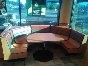 8 Person Corner Booth, Wood Grain Laminate, steel structure support.