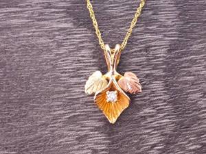 Diamond Center Tri-Colored Triple Leaf Necklace and Chain in Black Hills Gold