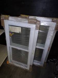 Pair of Vinyl Slider Windows still in package  19 x 36