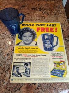 lot 49 image: Vintage Shirley Temple Childs Mug and Advertisement