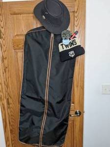 lot 320 image: Garment bag, MN Twins Winter Hat, and Aussie Chiller hat