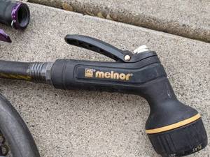 lot 857 image: Black Water Hose and Two Adjustable Spray Nozzles