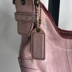 lot 72 image: Coach Hobo Mini Baby Pink Leather Handbag