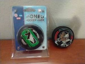 2 UND Hockey Pucks