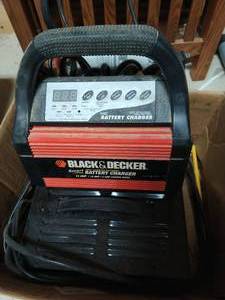 lot 462 image: Two Battery Chargers and Head Lamp
