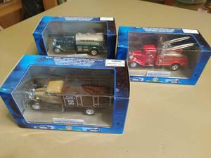 lot 271 image: Three Ford Model Trucks