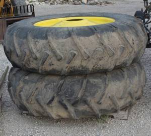 2 goodyear 18.4-34 tires and rims off J.D. 4020