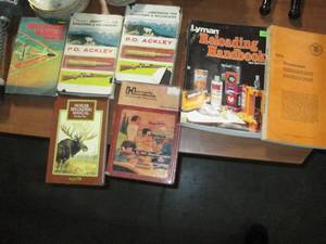 Stack books on Firearms reloading. ...