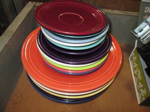 Stack of Fiestaware plates and sauc...