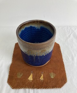 Midnight Blue and Brown Ceramic Vessel signed by Artist and Placemat