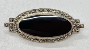 Sterling Silver, Black and Marcasite - Two Necklaces, Five Earring Pairs and One Large Pin.