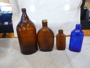 3 Brown Bottles and Blue Bottle
