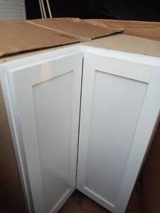 Courtland Shaker Assembled 30 in. x 34.5 in. x 30 in. Stock Lazy Susan Corner Base Left Kitchen Cabinet in Polar White by Hampton Bay- open box not used -slightly damaged- see pictures