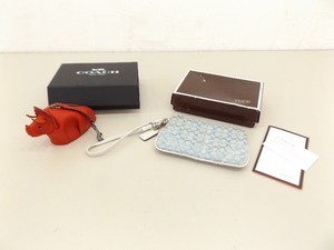 lot 86 image: 2 NEW Authentic COACH Signature Mini Clutch Purse and Dinosaur Coin Purse in Original Boxes