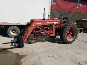 lot 1 image: McCormick Farmall 450 and Attachments