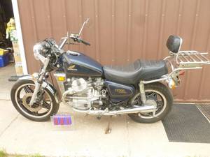 lot 1 image: 1979 Honda CX500 custom.Vin PC012006829. Plate 73859MJ. Tabs good till 222.  Approx 9800 miles. Good runner. 2nd owner. Original paperwork. Needs minor clean up & rear tire. As shown. THIS ITEM HAS A RESERVE.
