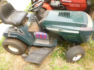 lot 2 image: Craftsman 42 lawn tractor with 15hp Kohler engine. Hydrostatic drive. Consignor states it runs but needs ignition switch & minor tlc. As shown.