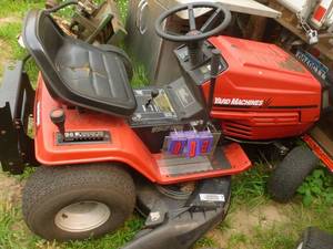 lot 3 image: Yard Machine 38 Lawn Tractor with manual transmission and 17hp Briggs & Stratton engine. Consignor states it runs but needs a drive belt. As shown.