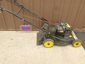 lot 10 image: Brute 6.75 hp Briggs self propelled mower. Consignor states it runs. As shown.