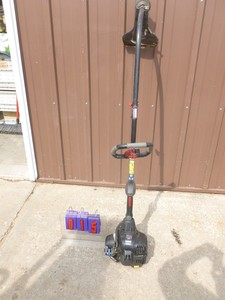 lot 15 image: Craftsman 2 cycle weed trimmer. Tested & works. Lightly used. As shown.