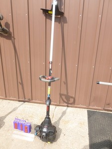lot 16 image: Craftsman 2 cycle weed trimmer. Tested & works. Nearly new. As shown.