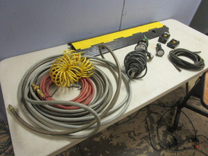 lot 536 image: DRIVE-OVER CABLE PROTECTOR, MAKITA 18V RECHARGEABLE BATTERIES, AIR HOSES, WORK LIGHT, MORE