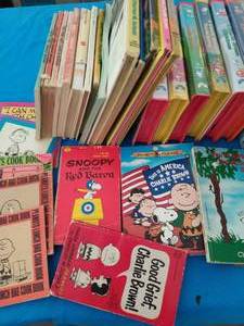 Collection of Peanuts Books and VHSs