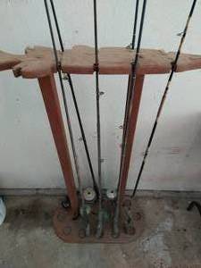 Collection of Fishing Poles and Stand