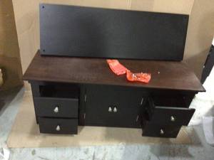 lot 77 image: Taylor 42 in. BlackBrown Standard Rectangle Wood Console Table with 4-Drawers Customer Returns See Pictures