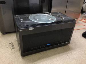 Samsung - 2.1 Cu. Ft. Over-the-Range Microwave with Sensor Cook - Fingerprint Resistant Black Stainless Steel display model in working condition may have scratches see pictures