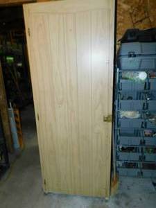 lot 62 image: Storage Cabinet W Sleeping Bag On Shelf--Hanging Camouflaged Hunting Suit--Miscellaneous Jackets & Vests & Snowmobile Suits