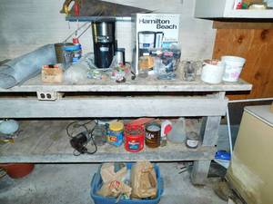 lot 92 image: Long Table Filled W Many Miscellaneous Items---Hamilton Beach Brew Station---Roll Of Screening Material---Hand Saw---Screwdrivers---Vintage Electric Drill---Containers Of Nails