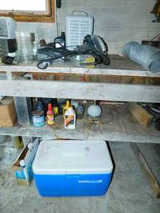 lot 93 image: Blue Coleman Cooler-Electric Heater-Four Electric Hand Tools-(Craftsman Tool-Skil Saw 7 14 Circular Saw)-Containers Of Nails & Screws-Snowmobile Injection Oil-Power Steering Fluid--Flower Pots