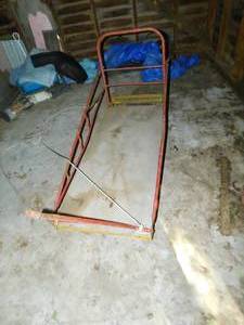 lot 87 image: Vintage Wooden Sleigh W Rails To Be Pulled In The Snow By Sled Dogs Or Whatever--Person Can Stand On Metal Step In Rear Of Sleigh